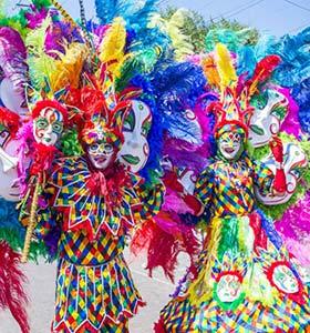 costumes feathers and fancy dress for traditional festival in Colombia