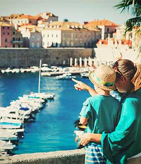 a mother and son look out over Dunrovnik