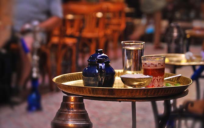 egyptian tea served traditionally on a gold tray on the streets of egypt