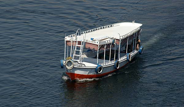 sailing down the river nile on a water taxi in egypt