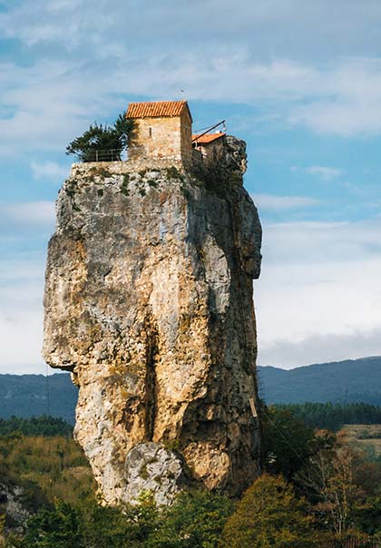 isolated church on top of katshki pillar in georgia