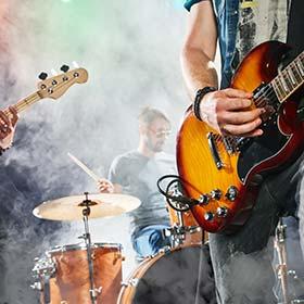 band on stage playing guitars and drums at iceland airwaves music festival in iceland