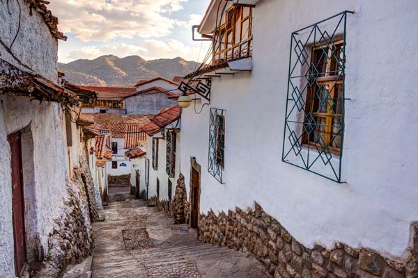 holliday tour group visots san blas as they are on a walking tour with a guide around cusco