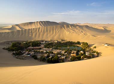 Sand dunes lagoon oasis desert une buggy, adventure holiday group tour to the deserts in Peru