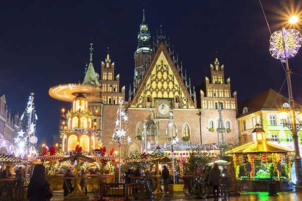 christmas market in poland with stalls and lights and games