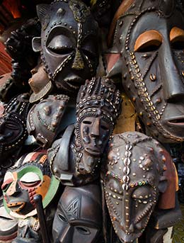 traditional wooden african masks being sold at karibu travel and tourism fair in tanzania