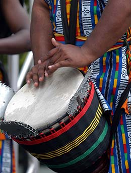 man playing traditional african drums at wanyambo festival in tanzania