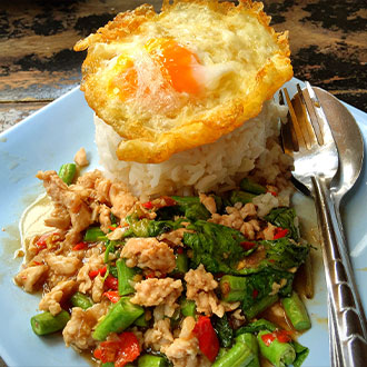 Traditional food of Thailand includes Pad Krapw Moo