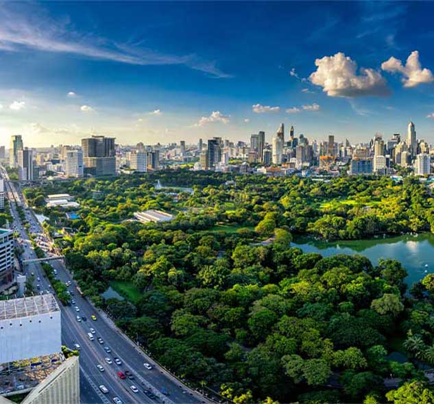 The Bangkok city skyline with Lumphini Park in the foreground 