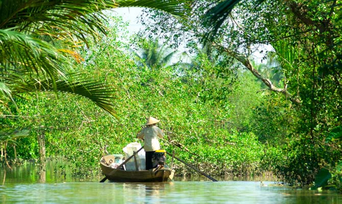 Local in Mekong Delta transports goods along the river