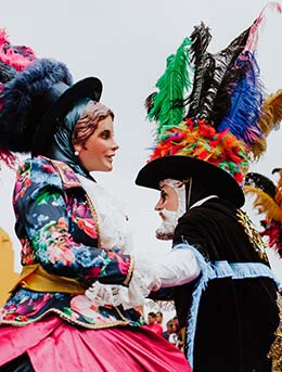 mexico carnaval parade people dressed in colourful costumes