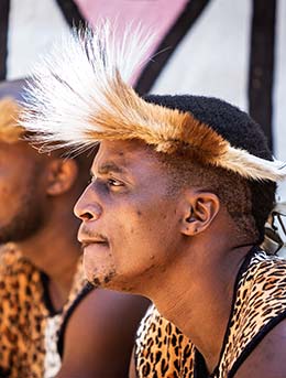 two men wearing traditional zulu clothes for the king shaka day celebrations