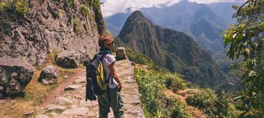 female solo traveller hikes her way towards machu picchu one of the historic wonders of the world