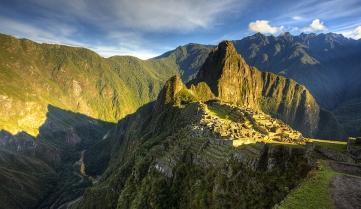 The sun rising over Machu Picchu, Peru